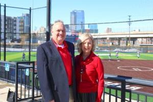 Judy and Brad Kaplan standing at the top of the stands at 密歇根州立大学丹佛's softball stadium.